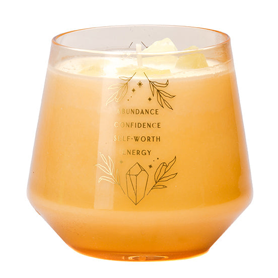 Citrine crystal healing scented glass candle on a wooden table, home decor with a warm, calming ambiance.