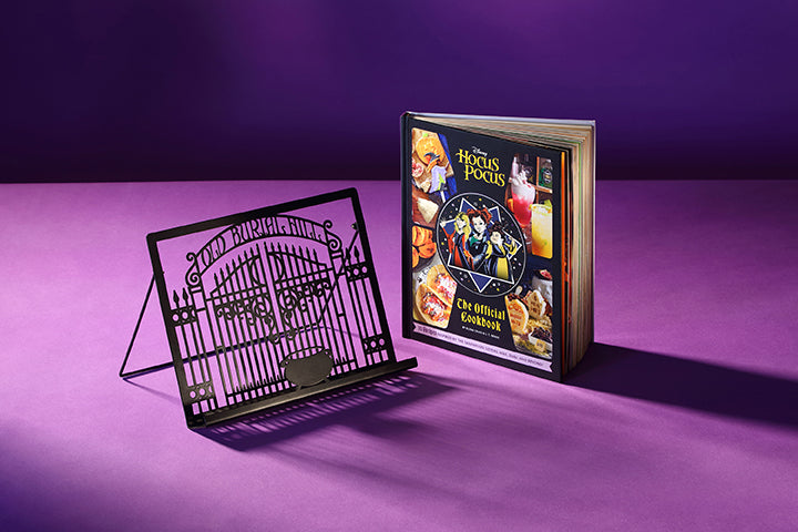 Open cookbook gift set by Insight Editions featuring Hocus Pocus-themed recipes and whimsical interior pages.
