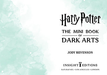 Open hardcover Harry Potter: The Mini Book of Dark Arts by Insight Editions, displaying pages with dark magic illustrations.