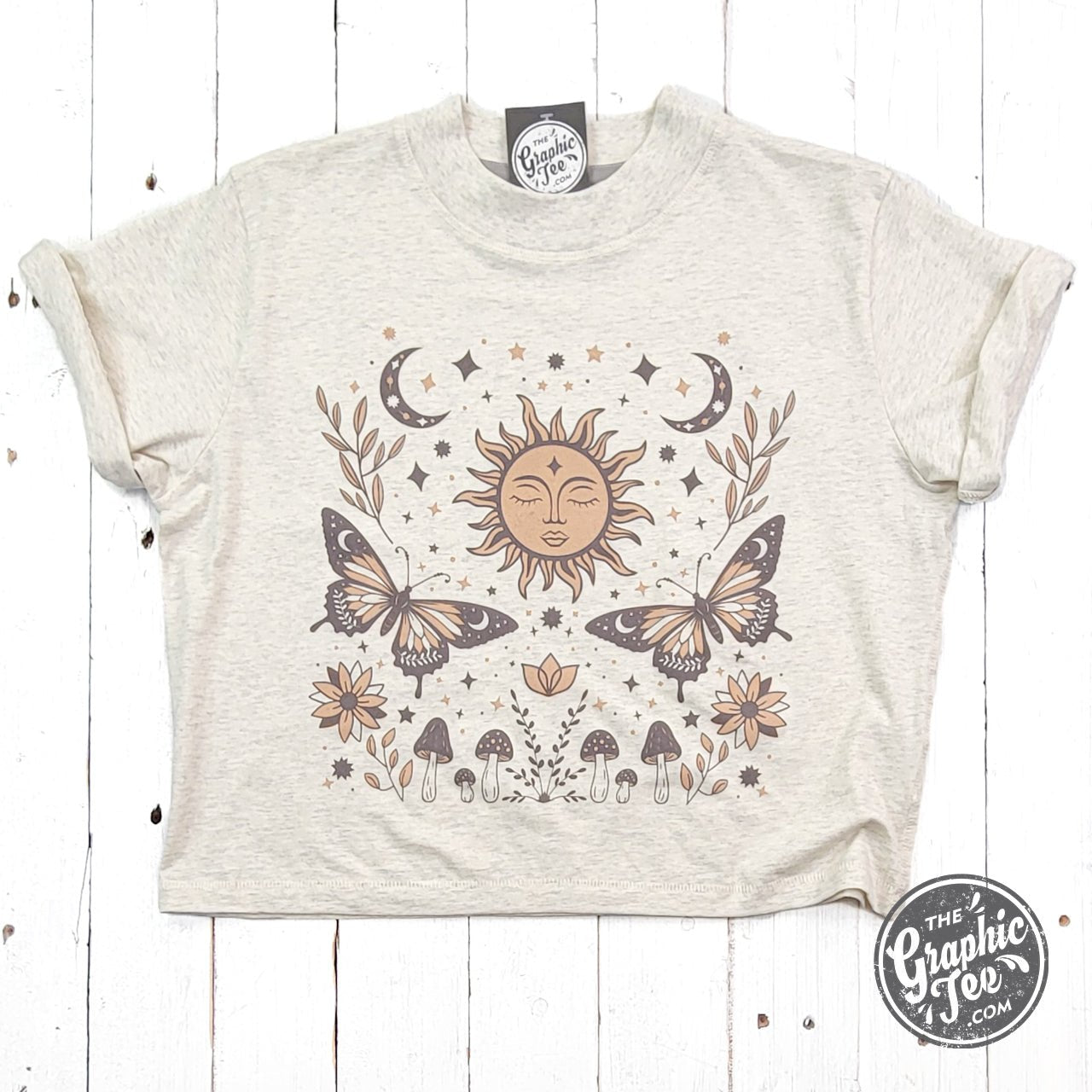 The Graphic Tee 90's Vibes celestial mid-length crop top with drop sleeves, featuring vibrant 90s-inspired celestial design.