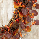 CozyNest Decor 22-inch fall eucalyptus berry wreath with rustic accents, perfect for front door or wall autumn decor.