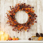 CozyNest Decor 22-inch fall eucalyptus berry wreath with rustic accents, ideal for front door or wall autumn decor.