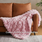 Pink fuzzy faux fur throw blanket by CozyNest Decor, thick and cozy plush bed blanket in king size for warmth and comfort.