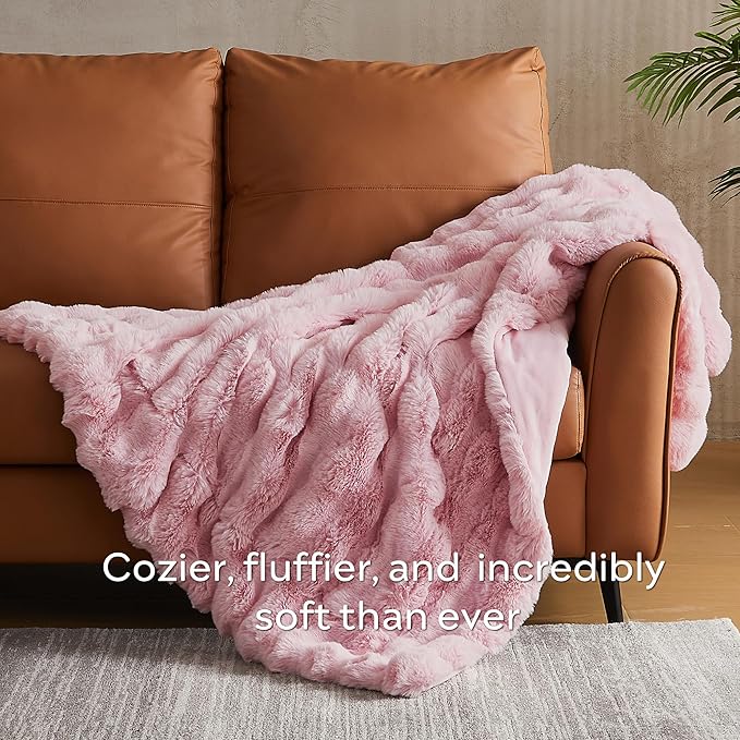 Pink fuzzy faux fur throw blanket by CozyNest Decor, thick and cozy plush bed blanket in king size for warmth and comfort.