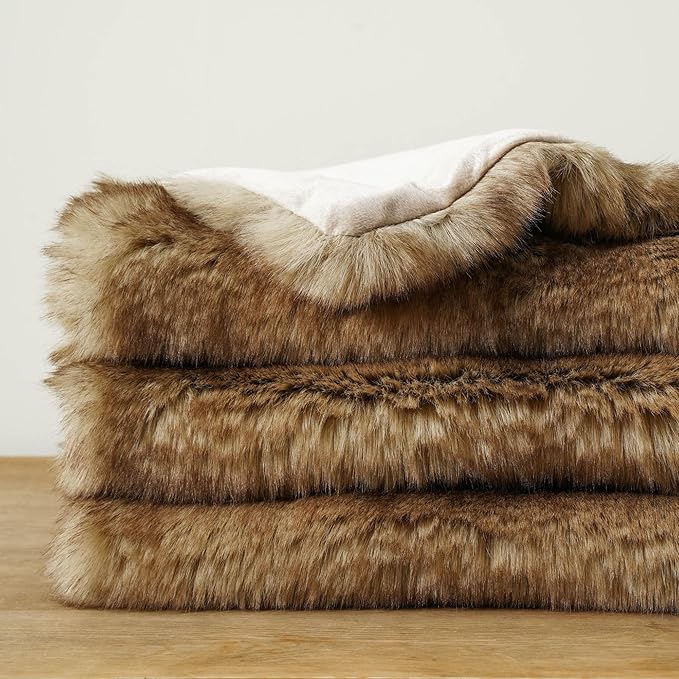 CozyNest Decor luxury ochre faux fur throw blanket on a sofa, soft plush mink fur for cozy home decor, 50x60 inches.
