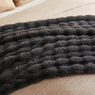 Dark grey jellymoni faux fur throw blanket from CozyNest Decor, plush and cozy bed throw, 50x60 inches, thick and warm.