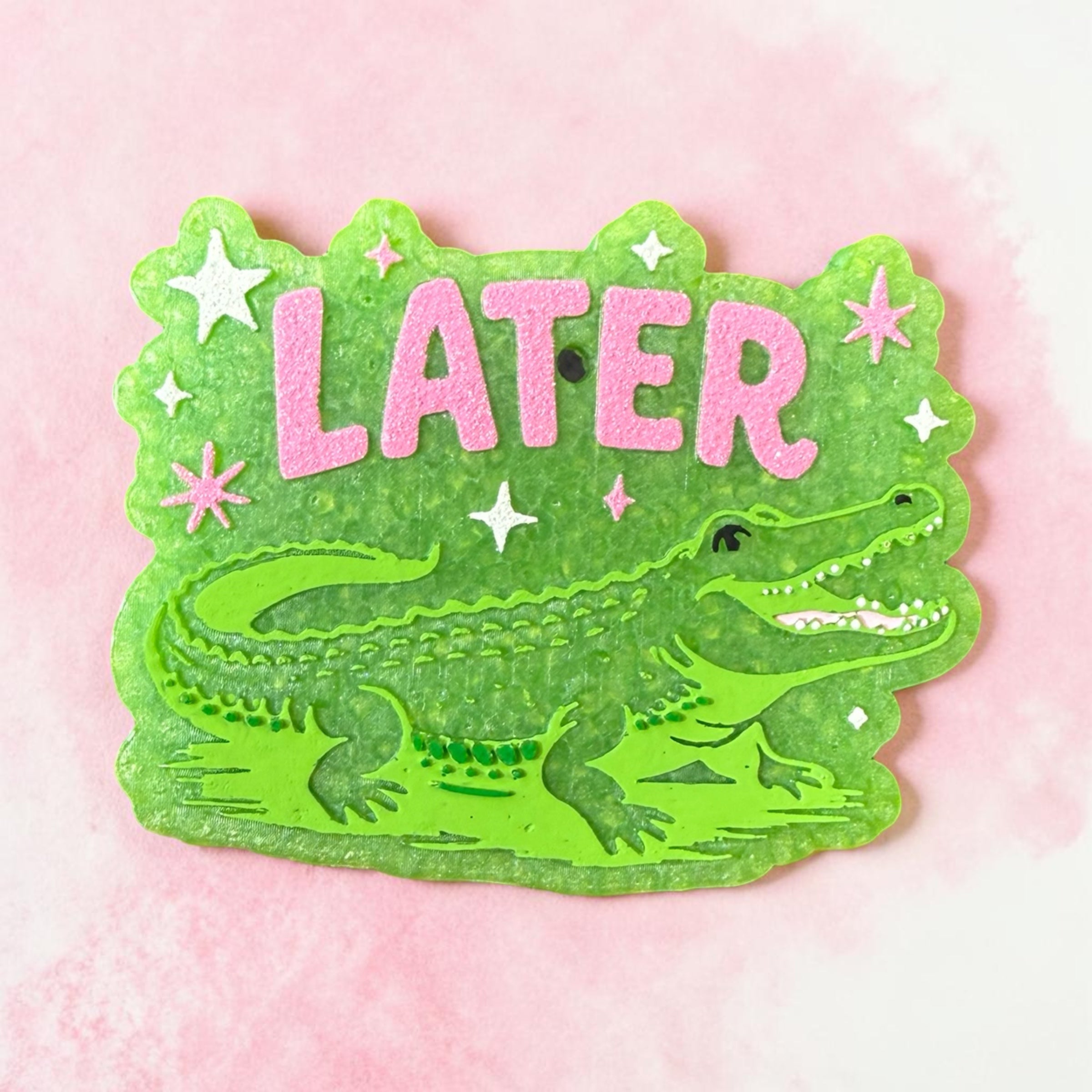 Bug & Bean Freshies Later Gator Freshie with green and yellow crocodile design hanging ornament for car or space freshness.