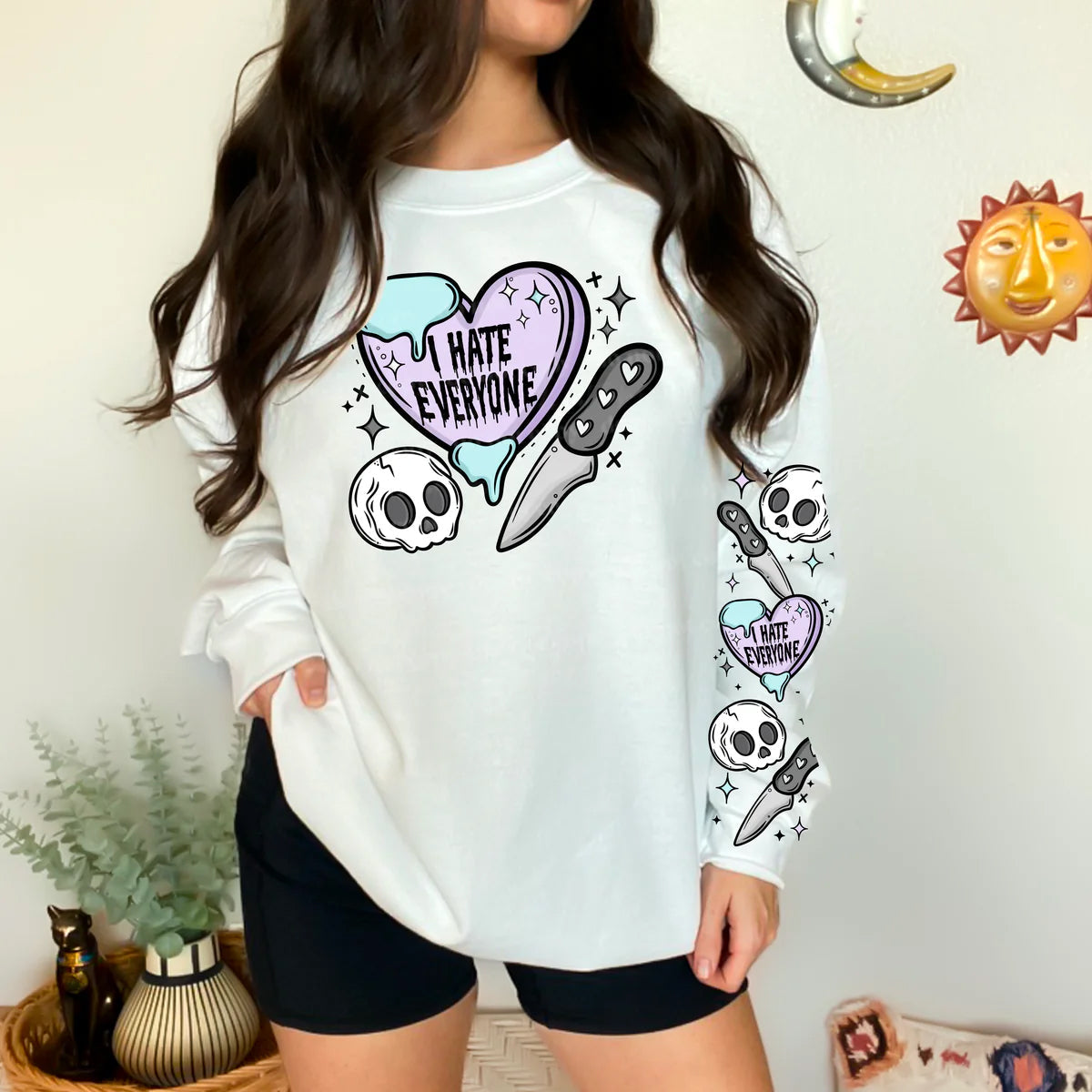 Black graphic tee by Anchored Grace Boutique with bold white text saying "I Hate Everyone" on the front.