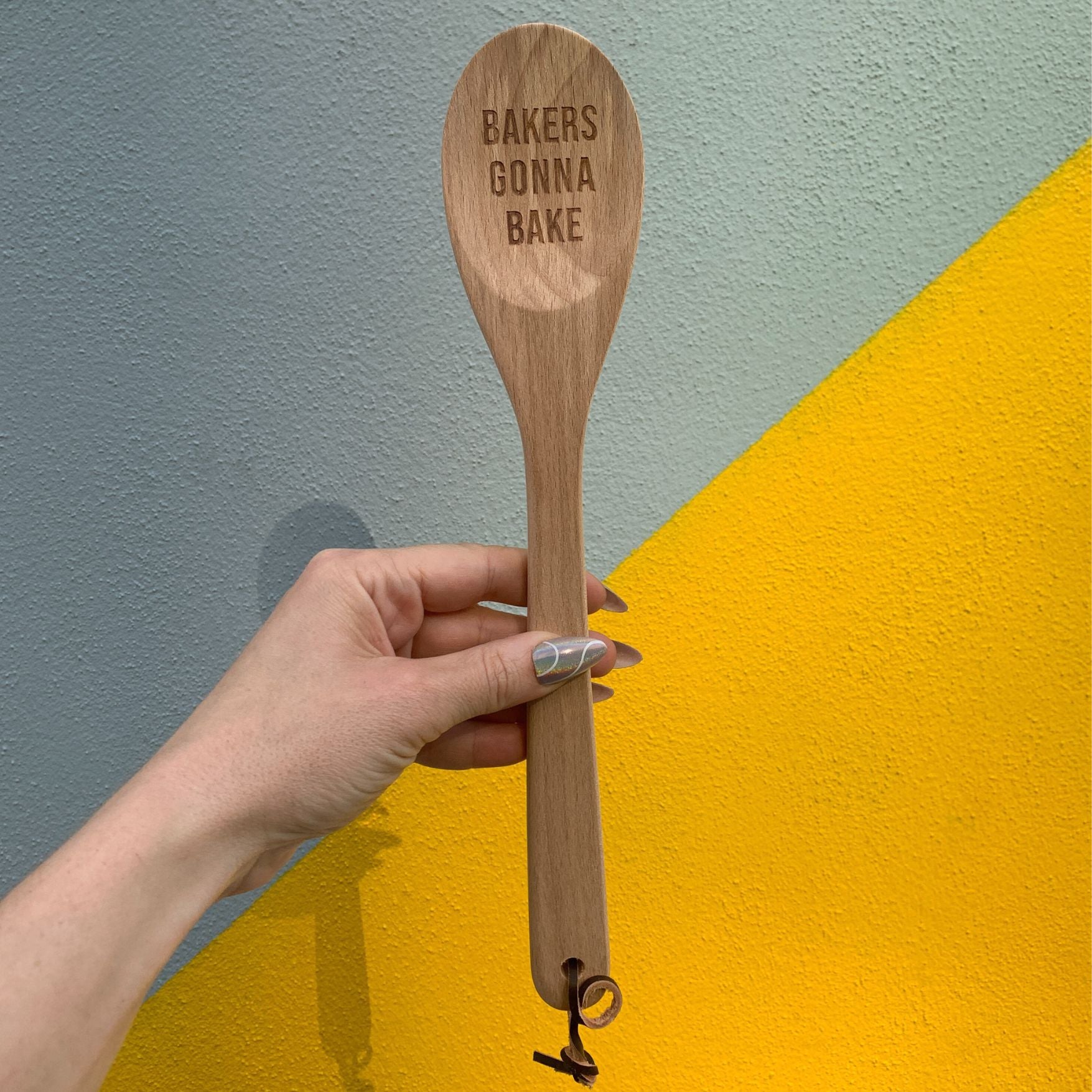 Wooden baking spoon from The Bullish Store in a canvas gift bag, perfect for baking and cooking kitchen utensils.