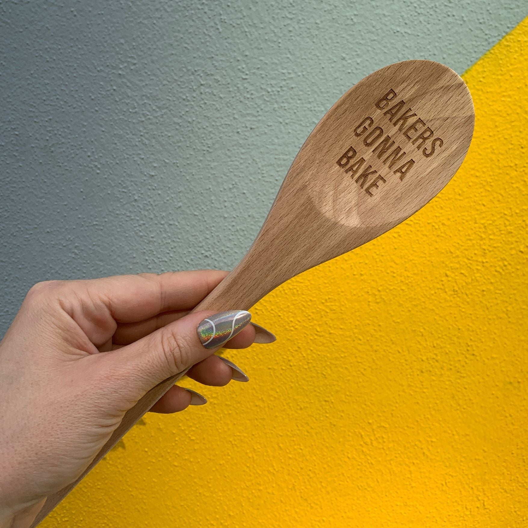 Wooden baking spoon from The Bullish Store in a canvas gift bag, ideal for baking and cooking in kitchen utensils collection.