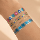 Temporary bracelet tattoo pack by The Bullish Store with 8 tattoo designs on a single sheet, ideal for easy, stylish body art.