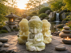 Handcrafted jade Buddha statue with serene expression, detailed features, and smooth finish, representing peace and tranquility.