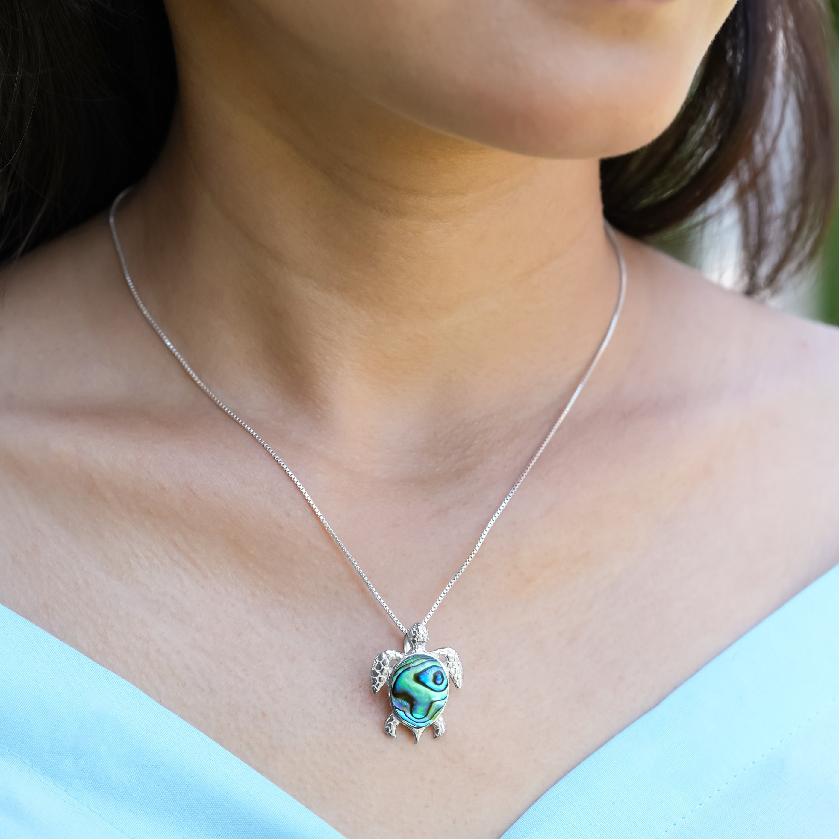 Starborn Sea Turtle pendant in fine sterling silver, detailed marine turtle design, hanging from a delicate silver chain.