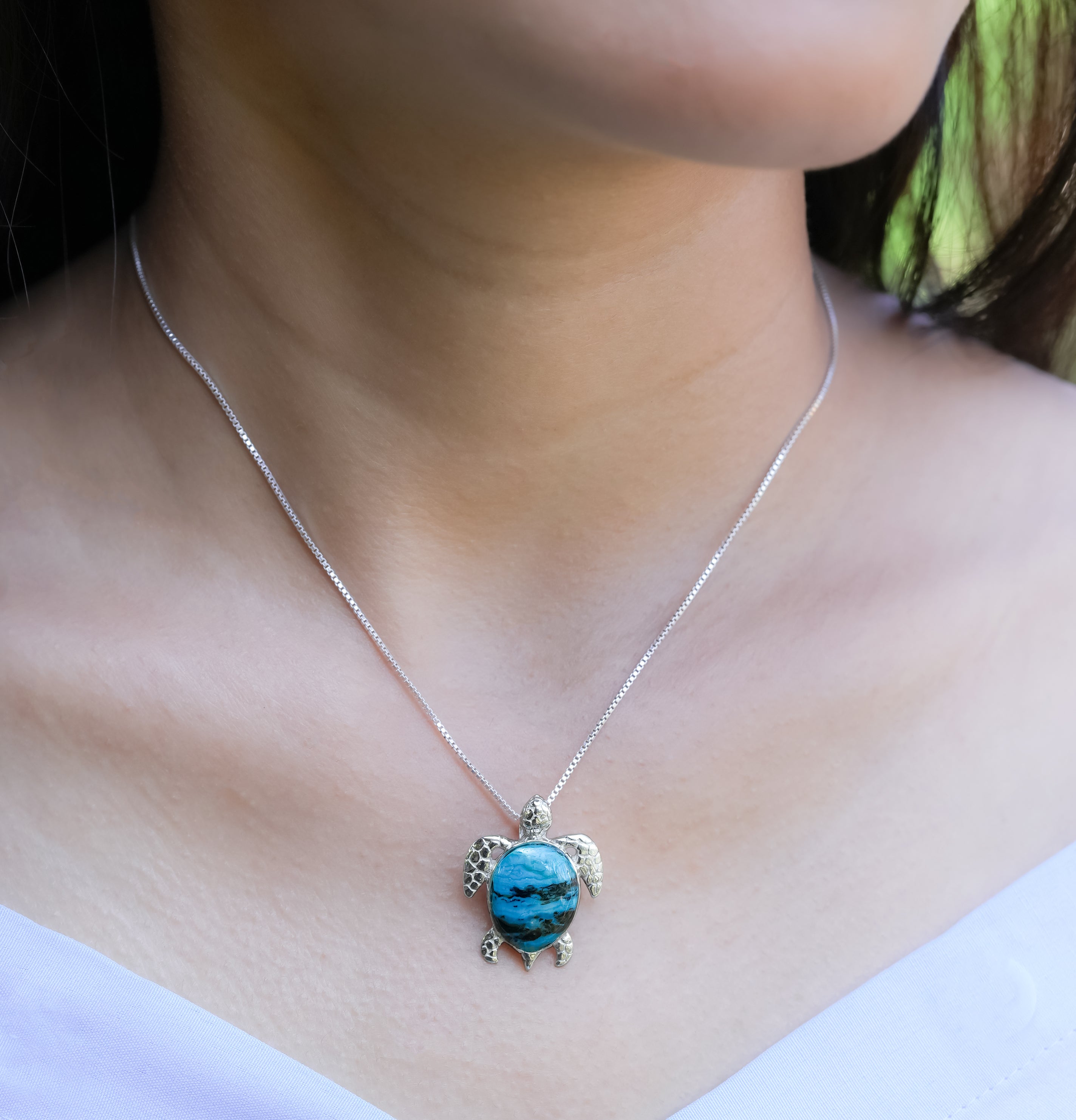 Sterling silver Starborn Sea Turtle pendant with intricate detailing, showcasing craftsmanship and ocean-inspired design.