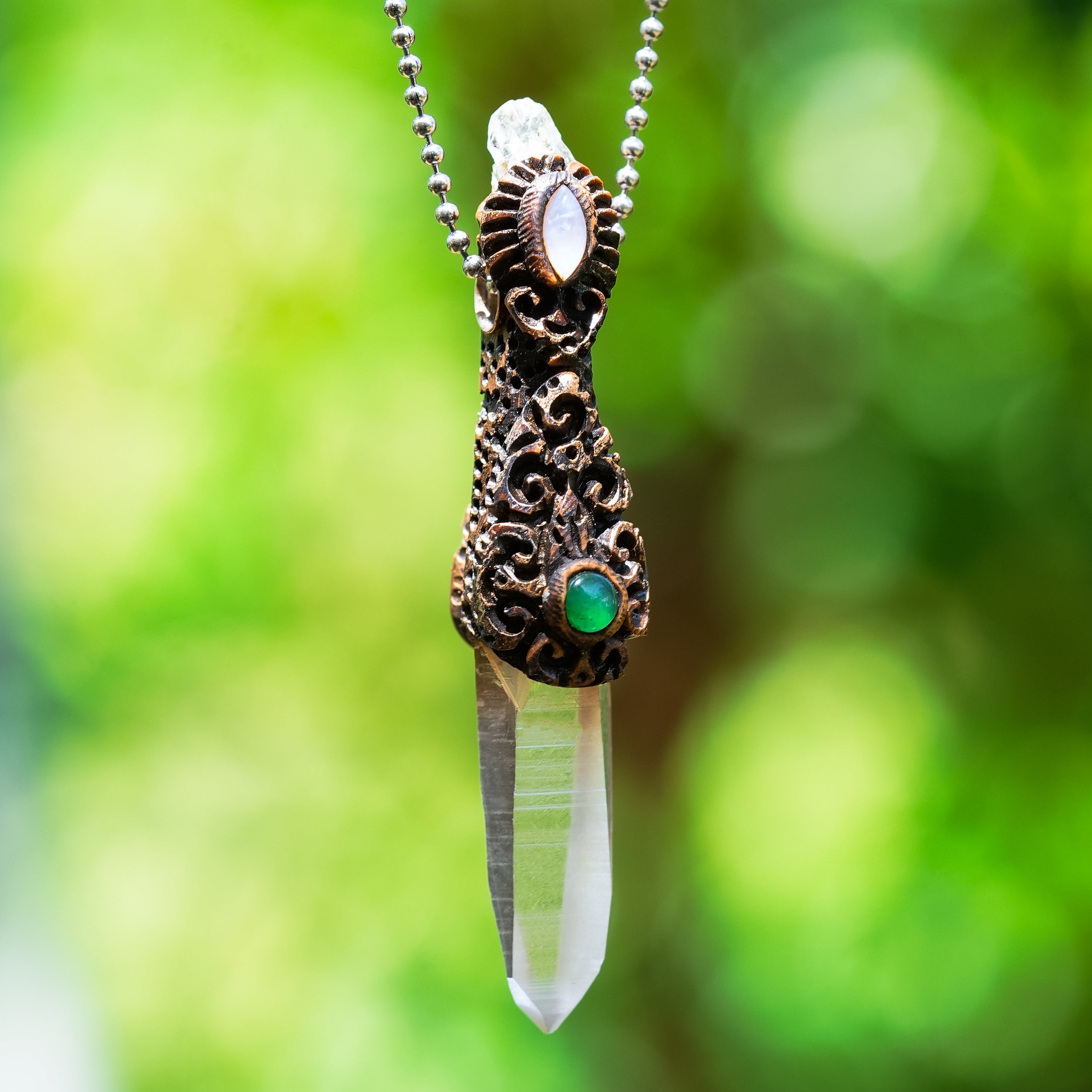 Starborn Quartz Crystal Wand Pendant with aquamarine, chrysoprase, and rainbow moonstone, showcasing a polished gemstone design.