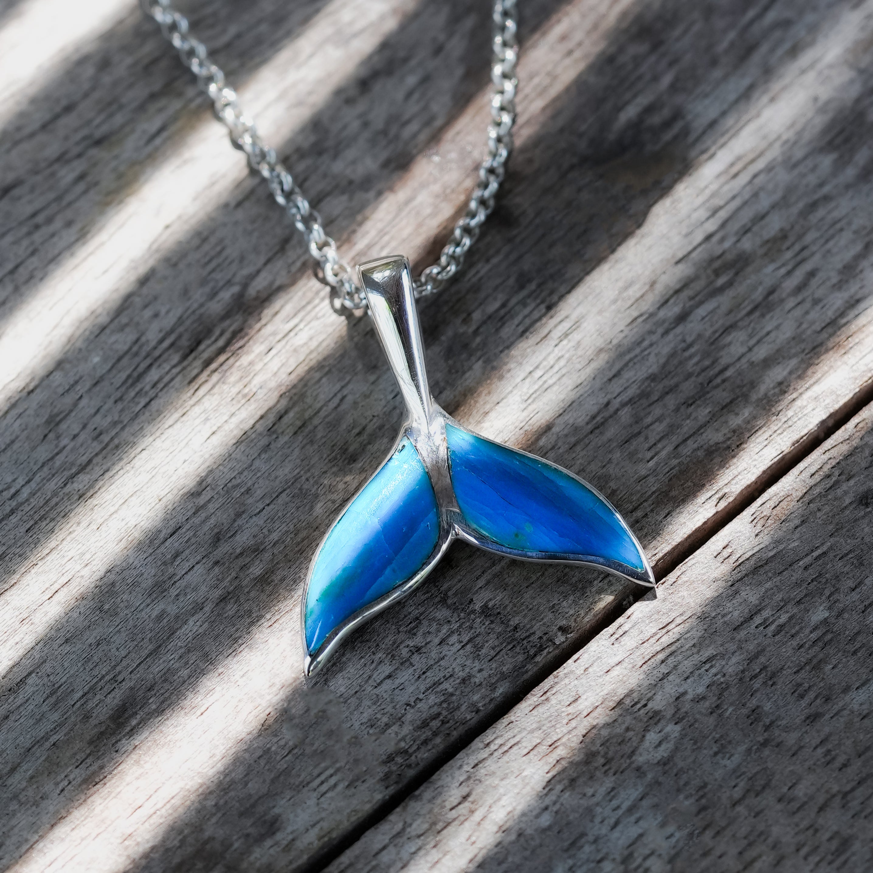 Peruvian blue opal whale tail pendant by Starborn Creations in sterling silver, detailed and polished, jewelry accessory.