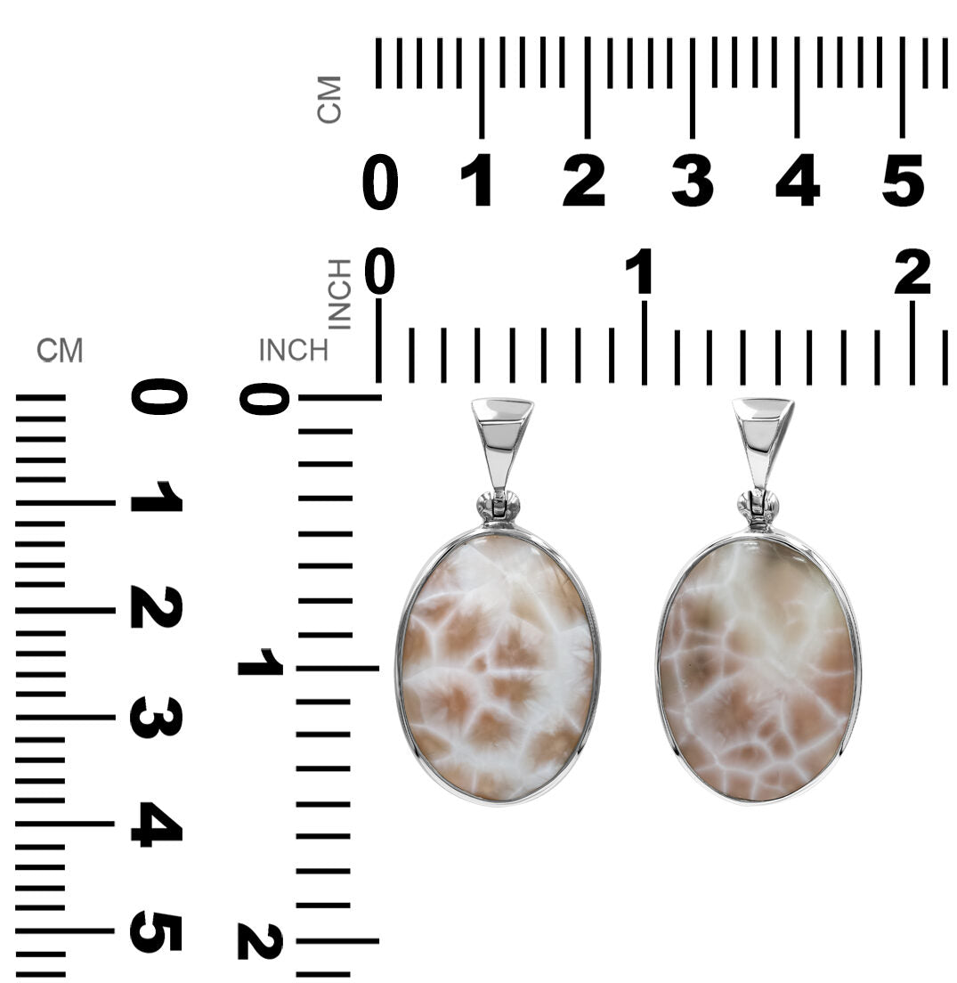 Starborn Pink Natrolite oval pendant in sterling silver, large size, showcasing a polished pink gemstone with silver setting.
