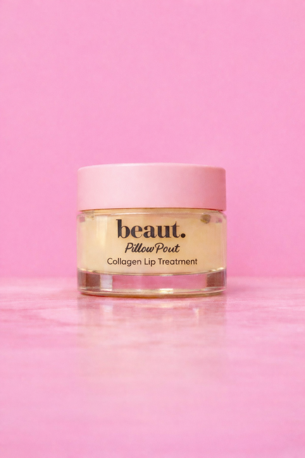 Beaut.beautyco. Pillowpout collagen lip mask shown on a model's lips, hydrating and plumping lip treatment for smooth, youthful lips.
