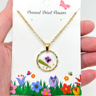 Dried flower pendant necklace with an irregular round design, featuring preserved flowers on a delicate chain, perfect for nature lovers.