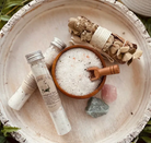 Eucalyptus spa herbal bath salts in a clear tube, with eucalyptus leaves and herbal accents, for relaxing body care and wellness.