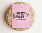 Anxiety University graphic tee by Anchored Grace Boutique featuring a stylish, casual design with printed text on soft fabric.