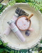Lavender bath salt tubes from Sage & Stone Apothecary, relaxing body care and wellness product with lavender flowers and salt crystals.