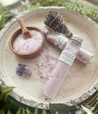 Lavender bath salts in a tube from Sage & Stone Apothecary, designed for relaxing body care and wellness.