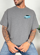 Shop Karma Tees Ford T-shirt with humorous "Get in Bitch, I found a deal on Marketplace" graphic, full front view.