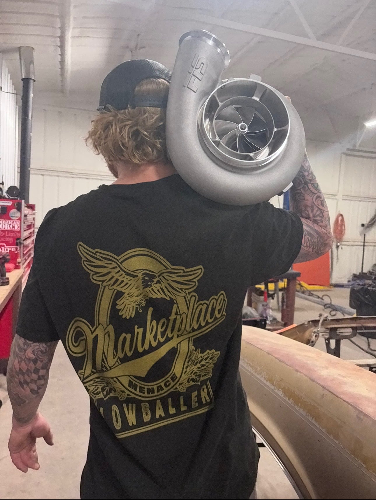 Marketplace Menace Shop Karma Tees graphic t-shirt featuring bold design and vibrant colors on a comfortable cotton fabric.
