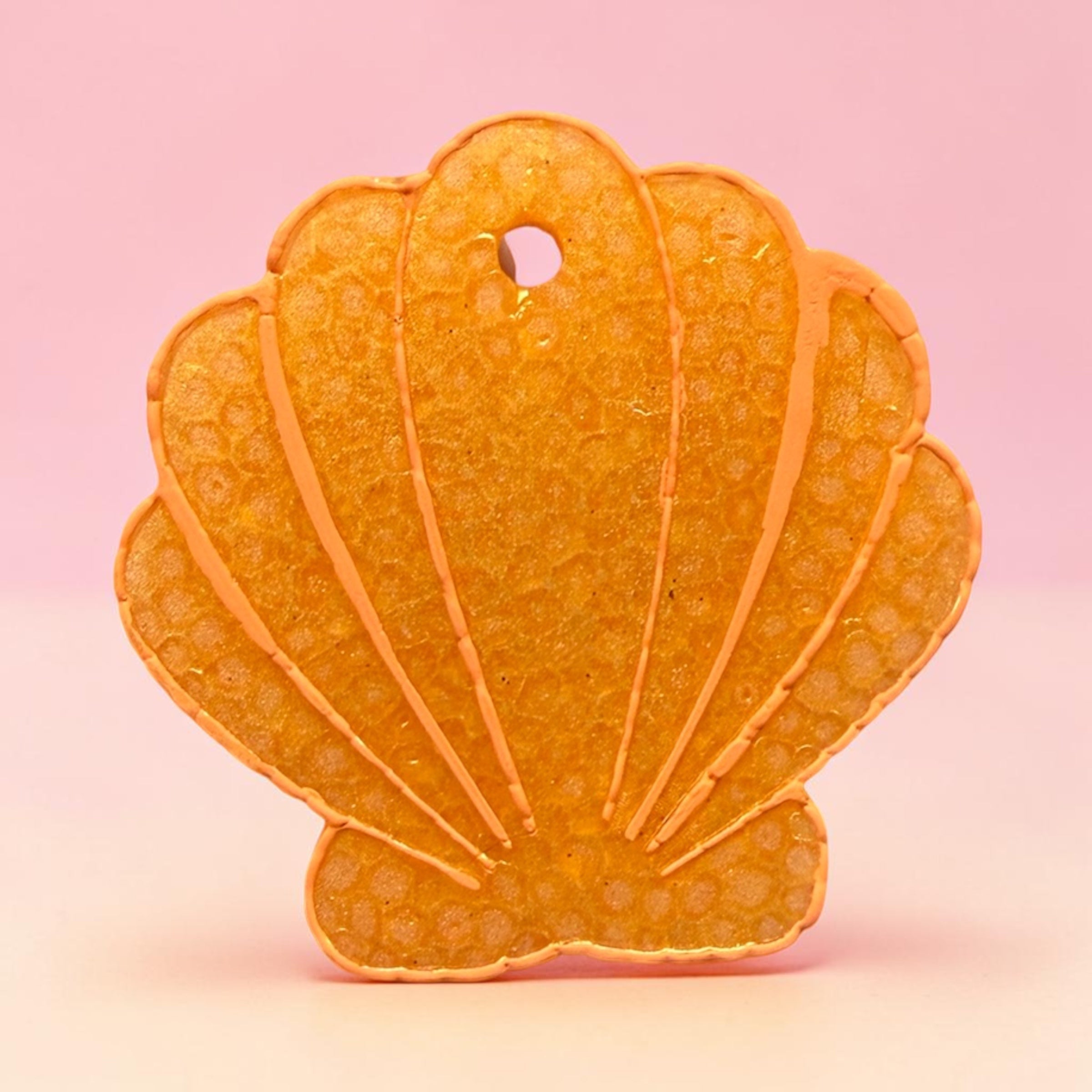 Medium coral shell-shaped freshie by Bug & Bean Freshies, featuring a vibrant coral color and shell design.