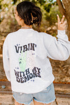 Vibin' with My Demons graphic sweatshirt by Shop Karma Tees, featuring a stylish design on soft fabric.