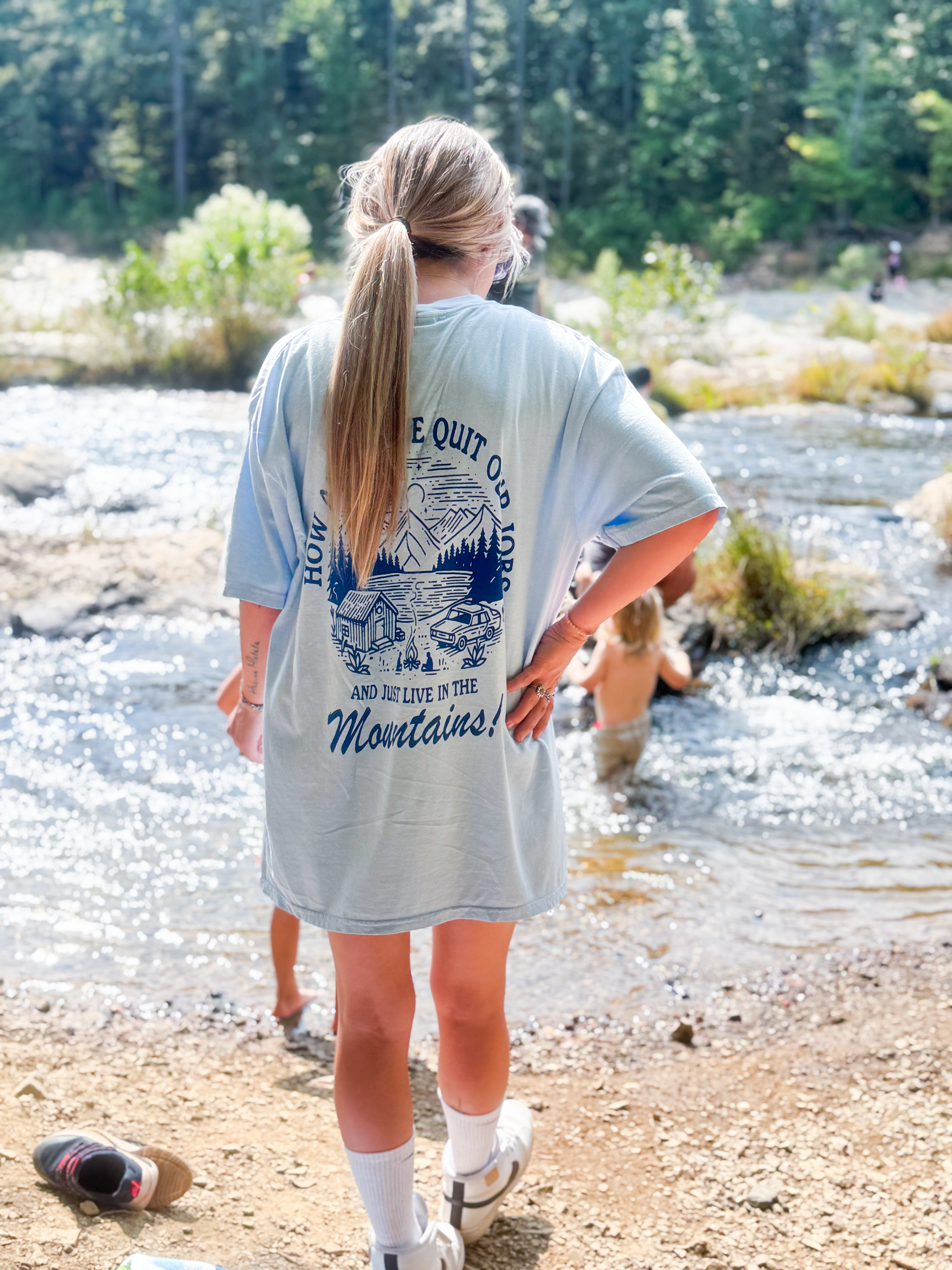 Let's Quit Our Jobs graphic T-shirt by Shop Karma Tees featuring bold lettering on a casual cotton tee.