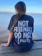 Black cotton t-shirt from Shop Karma Tees with "Not Friendly. Do Not Touch" printed slogan on front.
