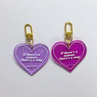 Heart-shaped keychain featuring the phrase "If There's A Woman There's A Way" from The Bullish Store, displayed on a keyring.