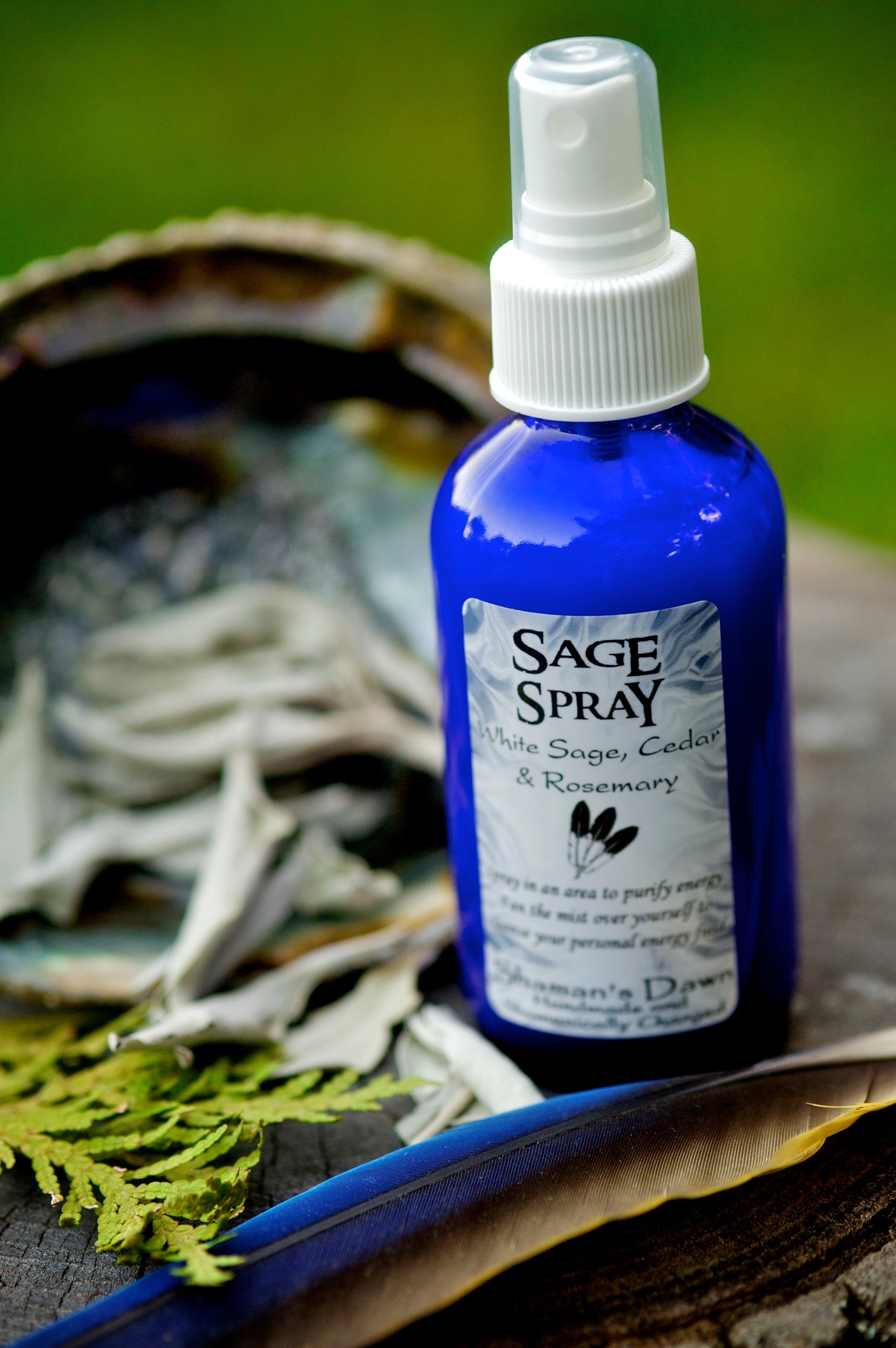 Shamans Dawn sage spray in a clear bottle, designed for smudging and cleansing spaces with natural sage aroma.