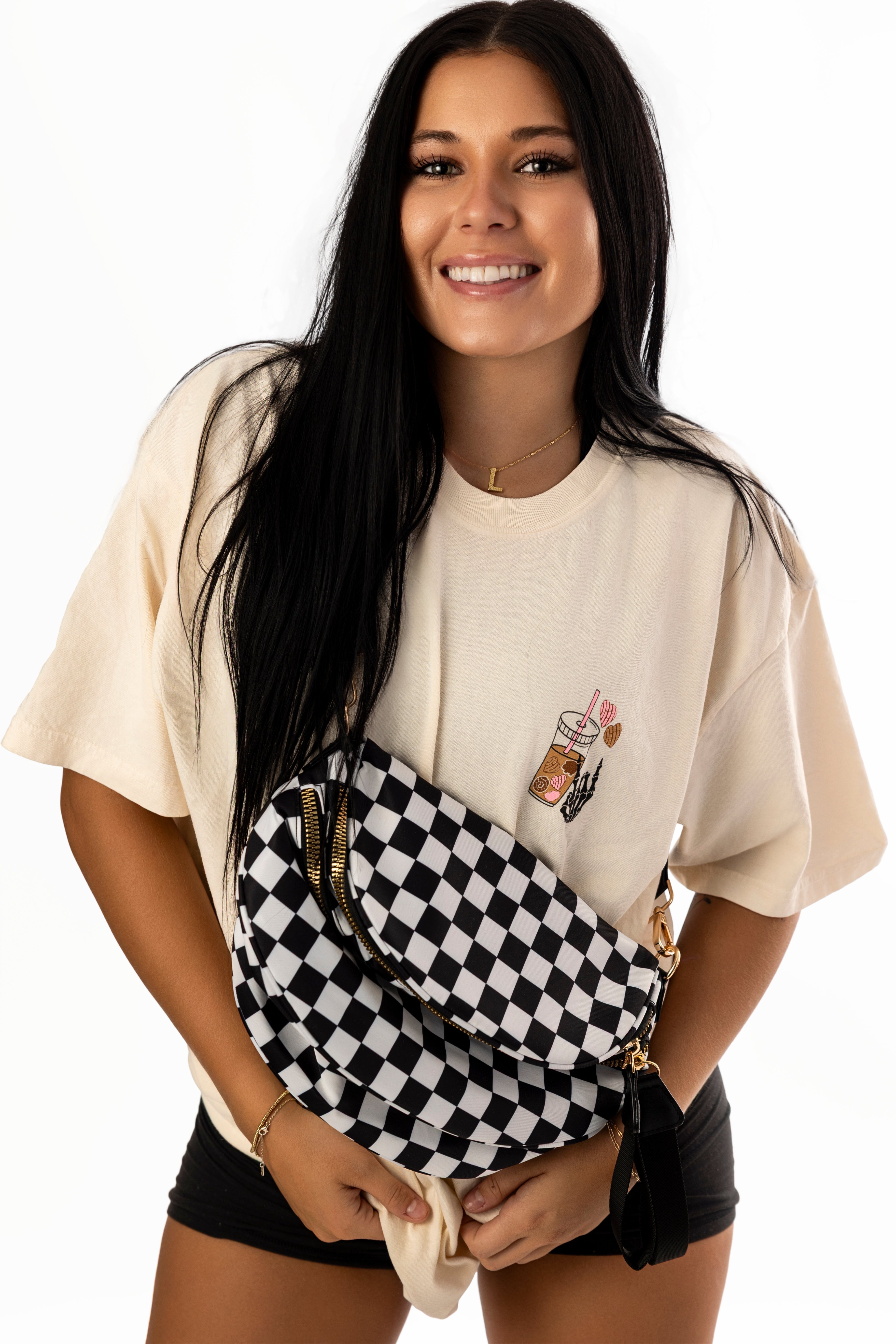 Black T-shirt with "Fueled by Cafecito Y Chisme" logo from Shop Karma Tees, casual fit, displayed on a white background.