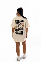 Black t-shirt featuring "Fueled by Cafecito Y Chisme" printed design from Shop Karma Tees.