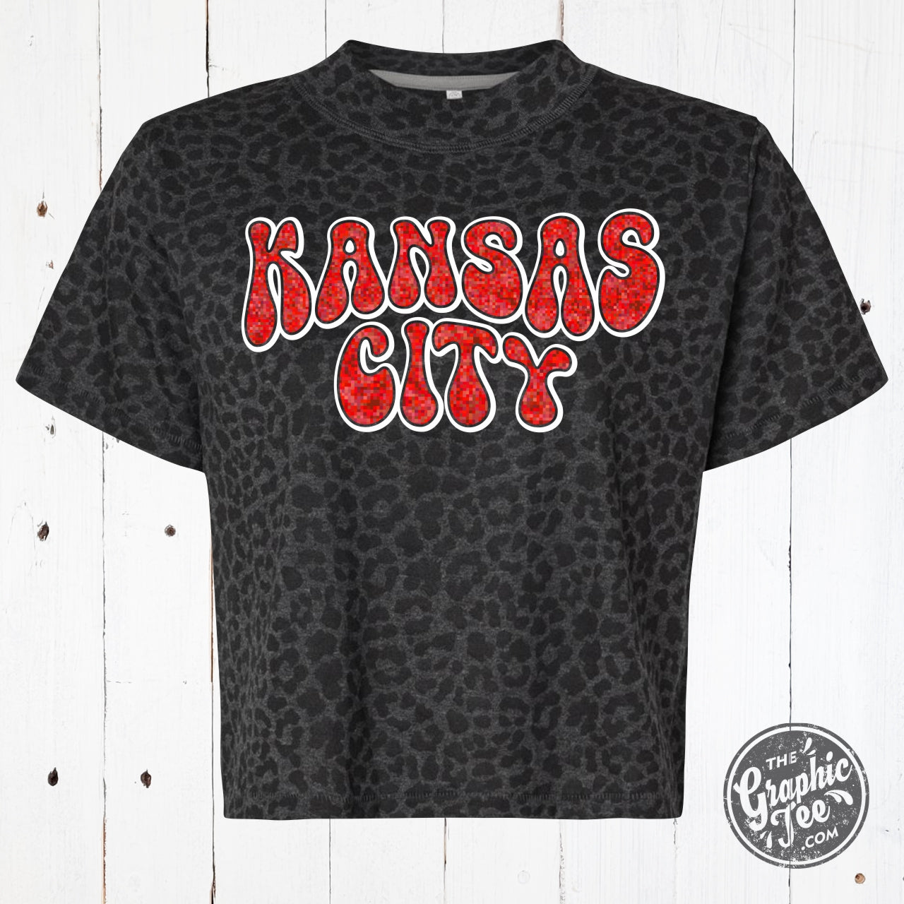 Kansas City Glitter Leopard Boxy Tee by The Graphic Tee, featuring a stylish leopard graphic on a white short-sleeve graphic t-shirt.