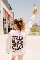 Coffee and anxiety graphic crewneck sweatshirt from Shop Karma Tees featuring a printed design on the front.