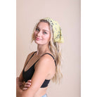 Muted yellow lemon boho bandana hair scarf and headwrap from The Bullish Store, stylish head tie and hair accessory.