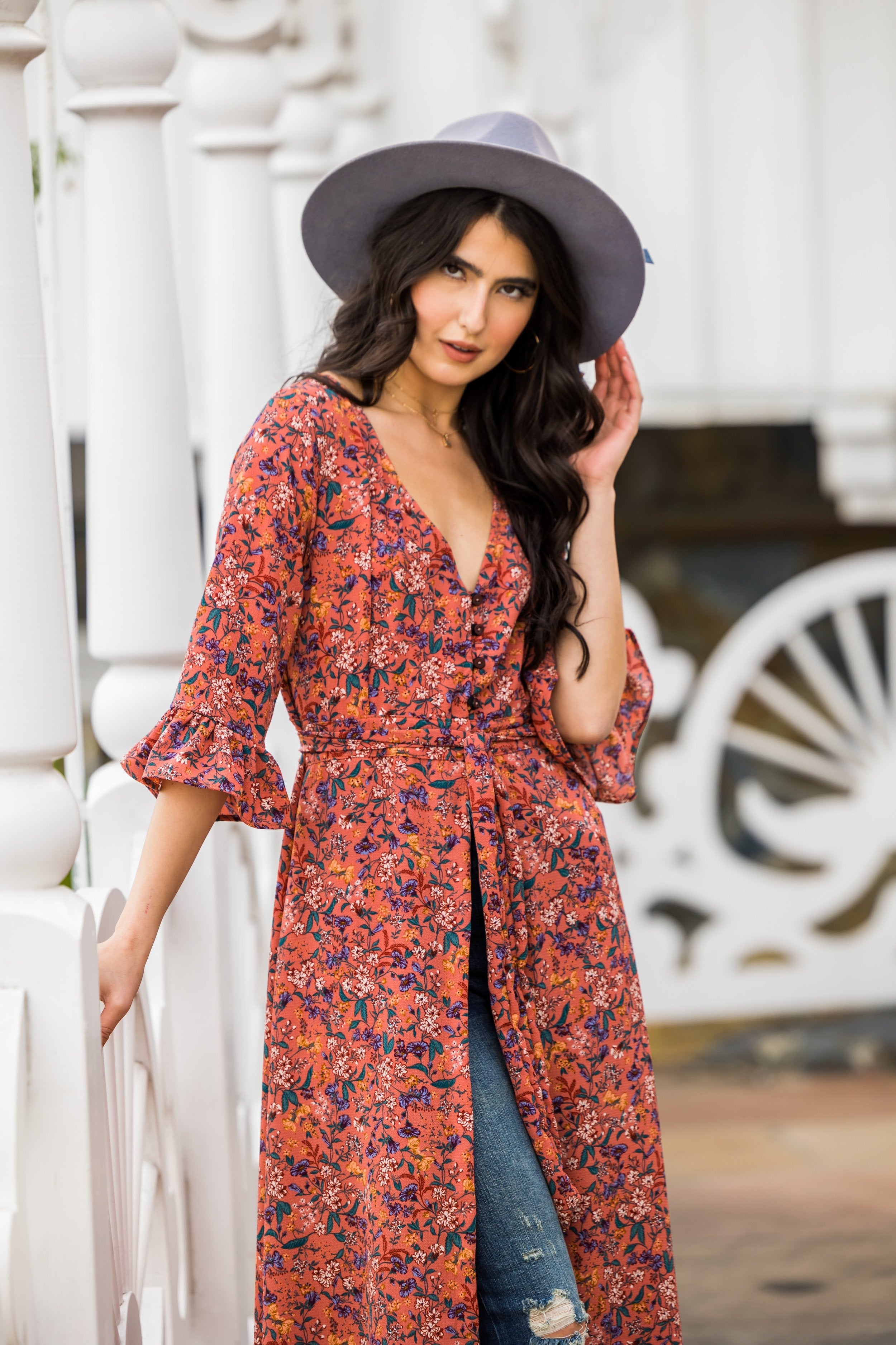 Jennafer Grace handmade prairie floral dressing gown with soft fabric and flowing design, displayed on a hanger.