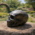 Pyrite skull sculpture from Practical Magic Store, featuring metallic gold-finished mineral crystal with detailed skull design.