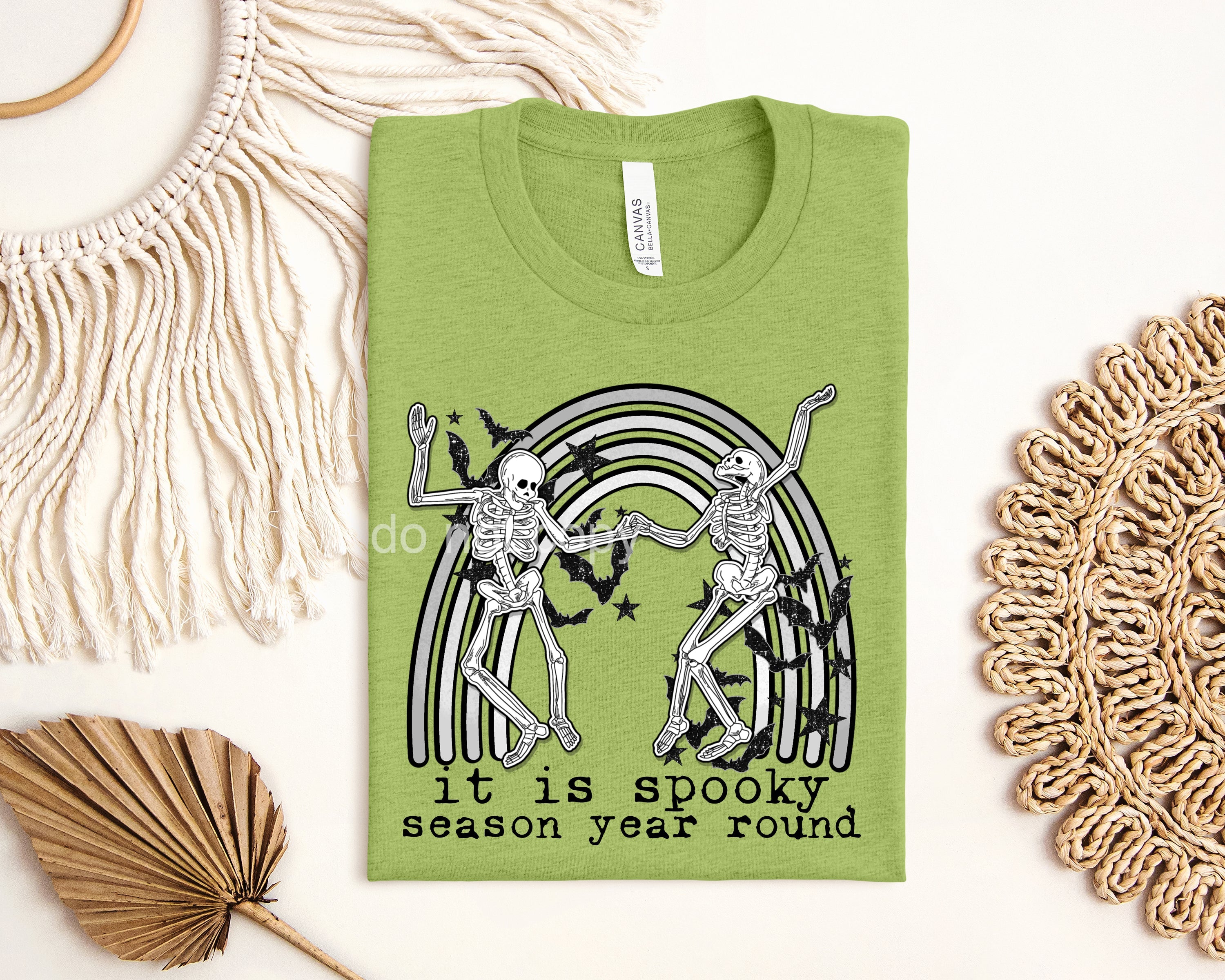 Spooky Season Year Round graphic tee by Anchored Grace Boutique featuring spooky Halloween-themed design on a casual t-shirt.