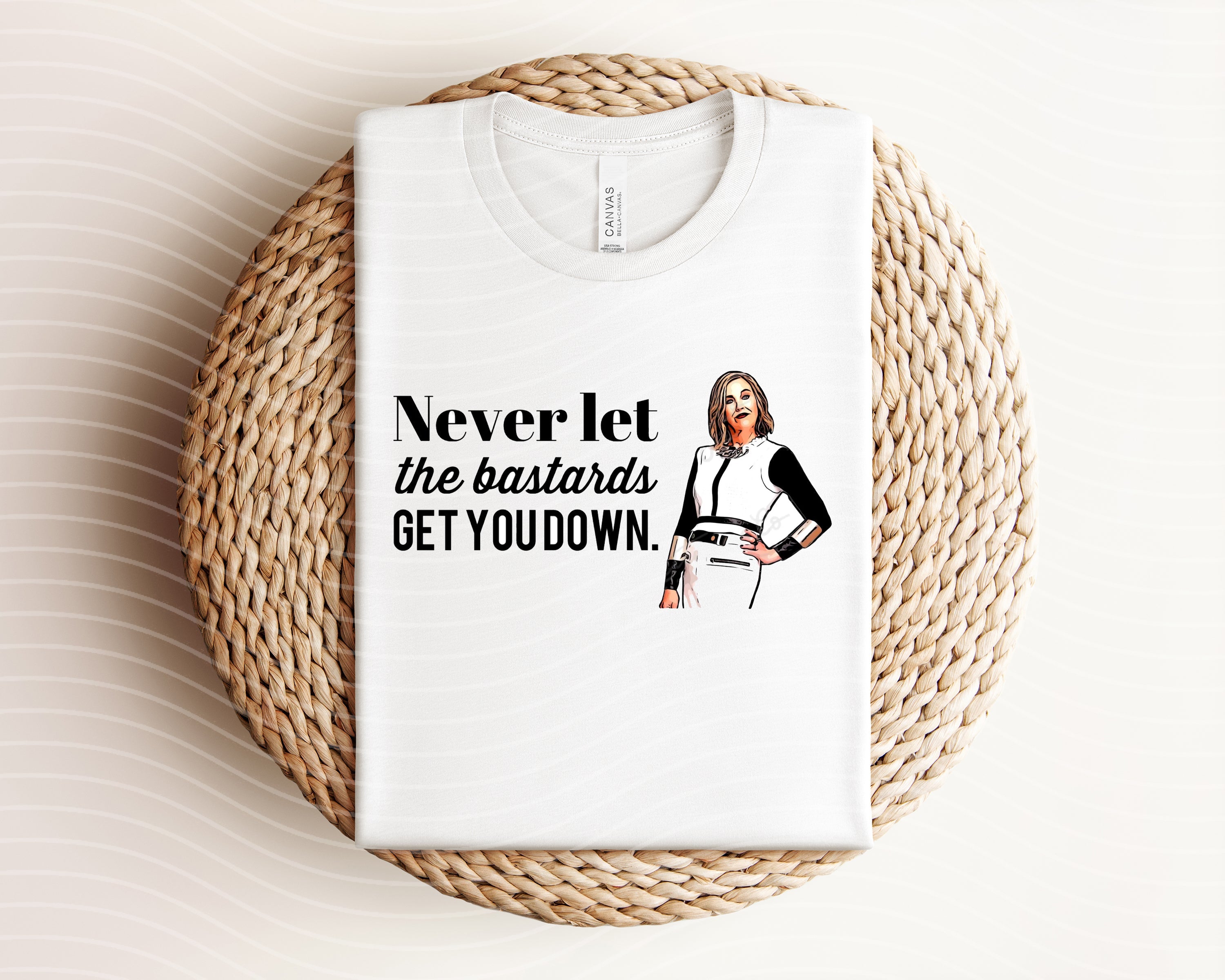 Anchored Grace Boutique graphic tee with bold "Never Let the Bastards Get You Down" design on black cotton shirt.