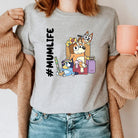 Blue dog graphic tee from Anchored Grace Boutique featuring "mumlife" design, casual short-sleeve t-shirt for pet lovers.