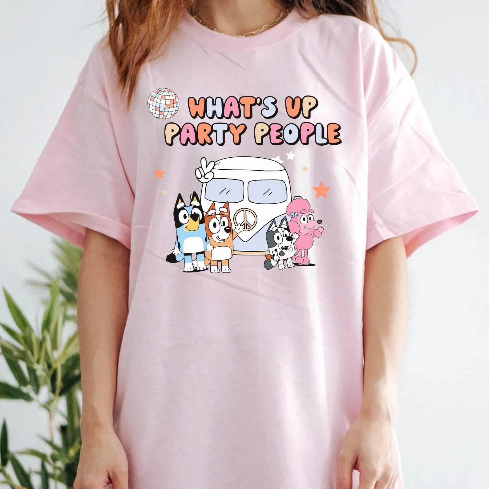 Blue dog graphic tee from Anchored Grace Boutique featuring "What's Up Party People" design on a casual short-sleeve t-shirt.