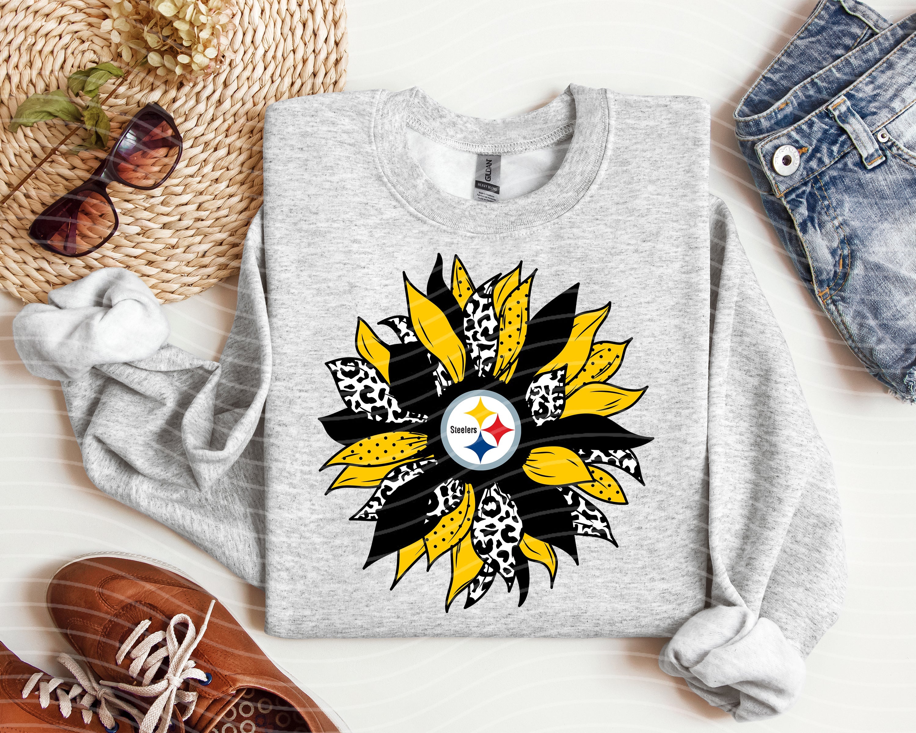 Steelers sunflower graphic tee by Anchored Grace Boutique featuring a vibrant sunflower and Steelers logo on soft cotton fabric.