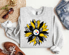Steelers sunflower graphic tee by Anchored Grace Boutique featuring a vibrant sunflower and Steelers logo on soft cotton fabric.