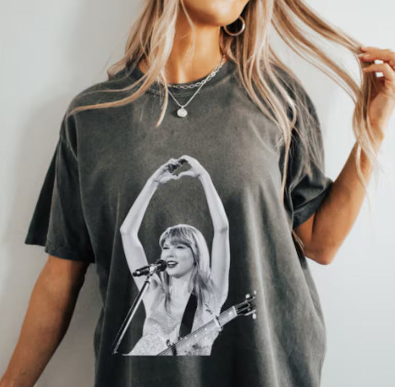 Black and white graphic tee by Anchored Grace Boutique featuring bold artwork on a casual cotton t-shirt.