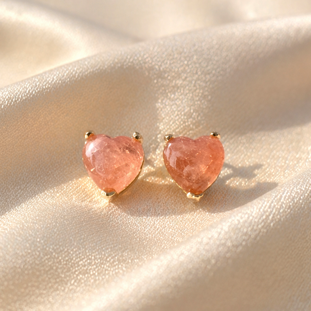 Rhodocrosite heart earrings with sterling silver studs and crystal accents, featuring a romantic and elegant design.